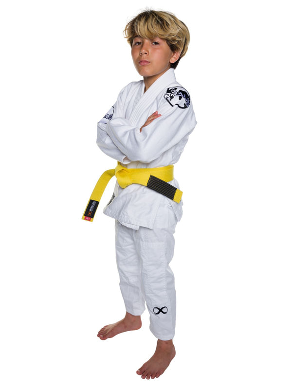Child wearing a white martial arts uniform with a yellow belt on a white background