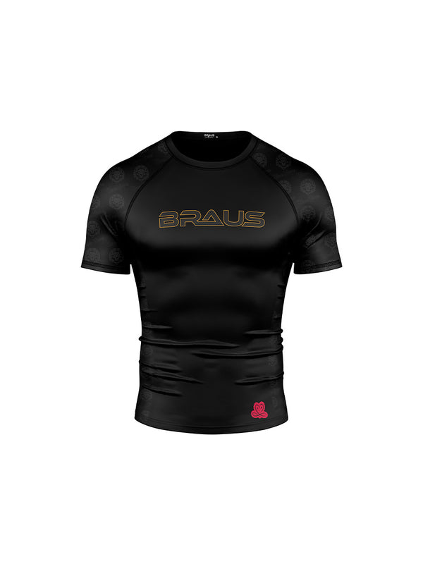 Black rash guard with a lion emblem and text design in the center, predominantly black with some red detail