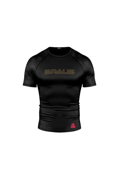Black rash guard with a lion emblem and text design in the center, predominantly black with some red detail