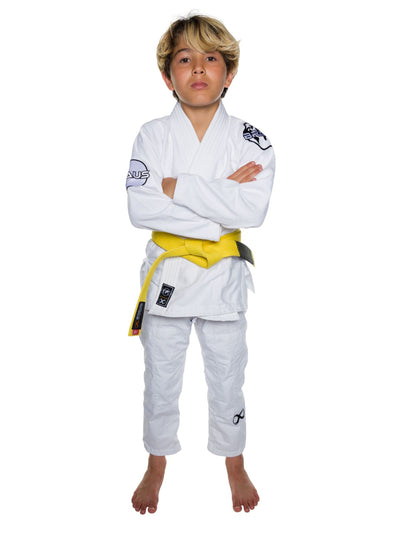 Child wearing a white martial arts uniform with a yellow belt on a white background