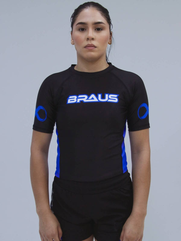 Person wearing a blue sports outfit with 'BRAUS' branding on a gray background