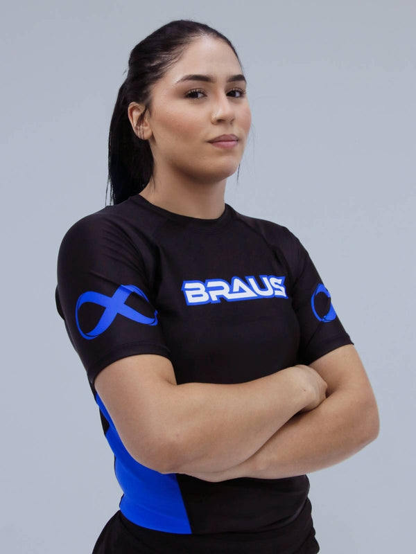Person wearing a blue sports outfit with 'BRAUS' branding on a gray background