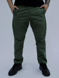 Person wearing army green pants with a brand logo on a plain background